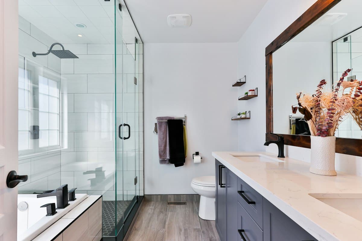 Neat towels and carefully arranged cleaning products in a calm residential setting